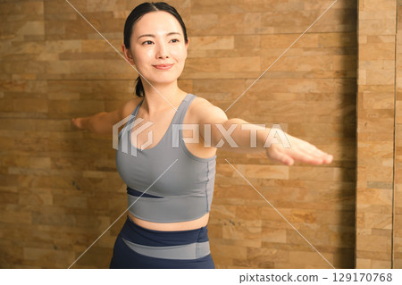 Young woman doing hot yoga beauty image 129170768