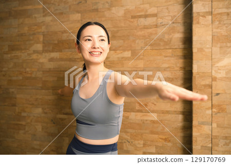 Young woman doing hot yoga beauty image 129170769