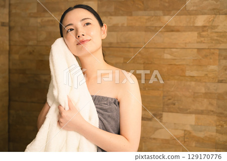 Young woman wiping sweat with a towel Beauty image 129170776