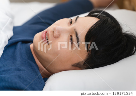 A young man who wakes up exhausted Lifestyle image A young man who wakes up exhausted Lifestyle image 129171554