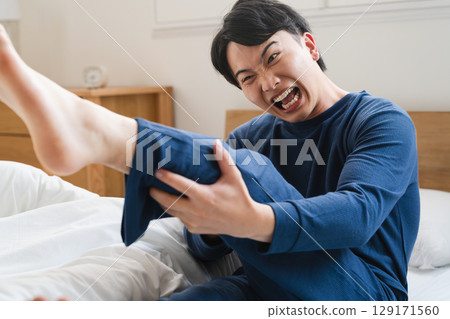 A young man with a cramp Lifestyle image 129171560