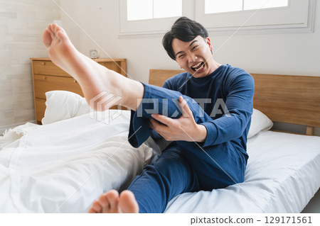 A young man with a cramp Lifestyle image 129171561
