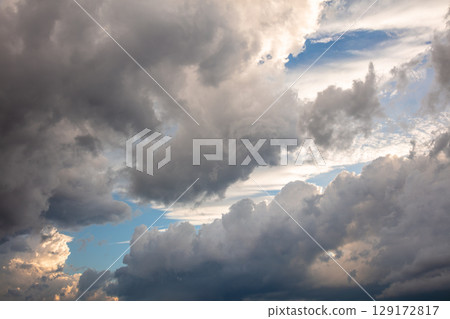 Dramatic Storm Clouds at Sunset 129172817
