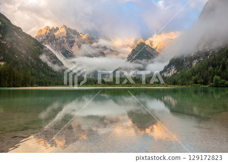 Golden Peaks Reflected in Morning Stillness 129172823