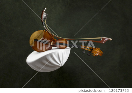 Abstract still life with a violin stretched out in space Abstract still life with a violin stretched out in space 129173733