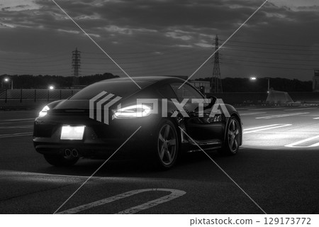 A shiny black sports car A shiny black sports car 129173772