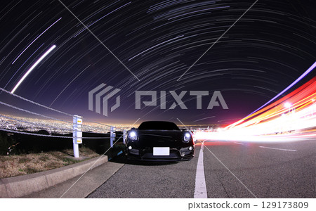 Black sports car and starry sky 129173809