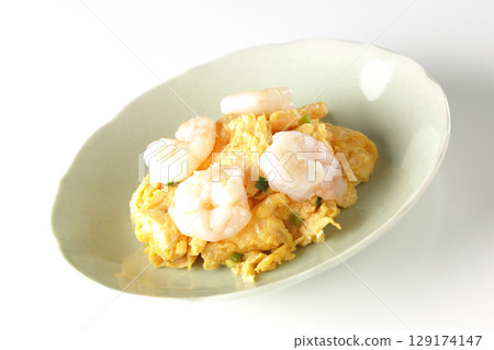 Chinese stir-fried shrimp and eggs photographed on a white background 129174147