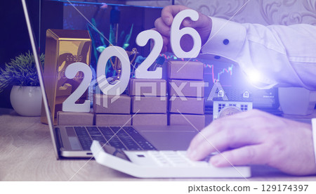 Business concept for 2026 investment planning showing gold, bitcoin, and real estate with rising charts and economic analysis. 129174397