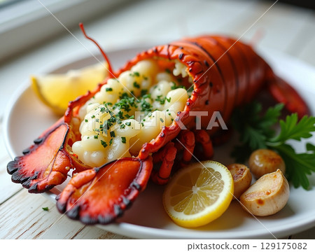 Decadent Grilled Lobster Plated with Fresh Parsley and Roasted Garlic 129175082