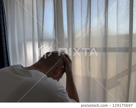 A tired middle-aged man 129175697