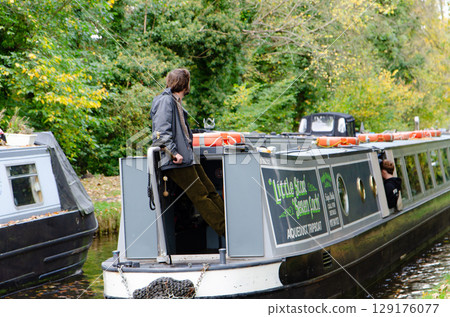 Pontecysyllte Aqueduct: A man piloting a narrowboat (Wales) 129176077