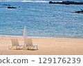 White sand beach and beach beds 129176239