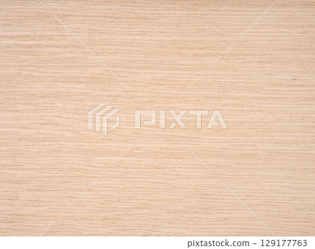 A harmonious blend of sandy beige and soft golden hues across a smooth oak wood veneer 129177763