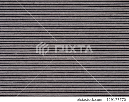 Sleek gray veneer surface with fine, uniform dark striations 129177770