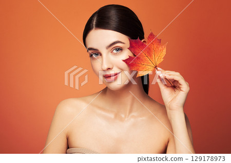 Autumn portrait of beautiful woman with clean fresh skin 129178973
