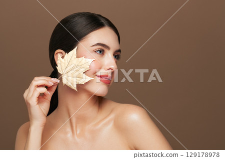 Autumn portrait of beautiful woman with clean fresh skin Autumn portrait of beautiful woman with clean fresh skin 129178978