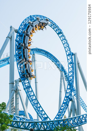 Roller coaster in the amusement park 129178984