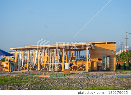Restaurant made of wood by the sea. Resort place. Cozy bar on the beach 129179025