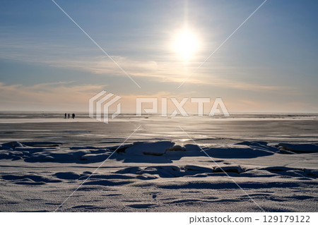 An amazing panoramic shot of the stunning winter landscape with a frozen lake and a clear blue sky An amazing panoramic shot of the stunning winter landscape with a frozen lake and a clear blue sky 129179122