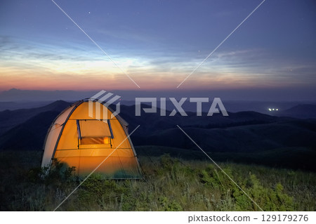 Camping at dusk. Camping at dusk. 129179276