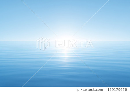 Calm ocean waters under clear skies at dawn. Space for text. 129179656