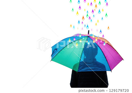 A man under an umbrella protecting from colored rain. Space for text. 129179720