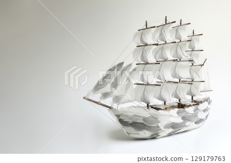 A sailboat made entirely of feathers. Space for text. A sailboat made entirely of feathers. Space for text. 129179763