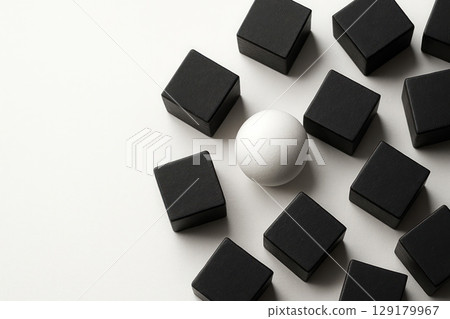 A white ball among black cubes on a white background. Space for text. A white ball among black cubes on a white background. Space for text. 129179967
