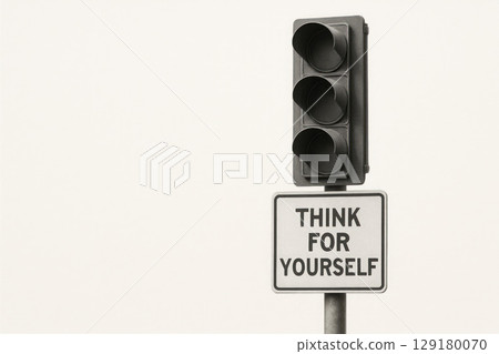 Traffic light with a sign Think for yourself on a light background. Space for text. Traffic light with a sign Think for yourself on a light background. Space for text. 129180070