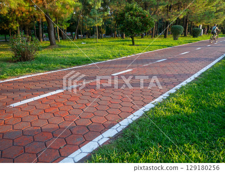 Bike lane concept. Healthy lifestyle. Urban space in a modern resort. Smart urbanism. Bicycle path close-up. Bike lane concept. Healthy lifestyle. Urban space in a modern resort. Smart urbanism. Bicycle path close-up. 129180256