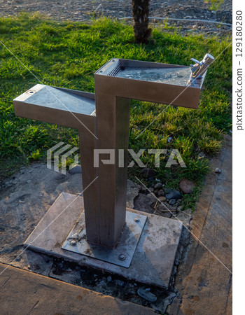 Water taps on the beach. Convenience of tourists. Small waterhole. Infrastructure. Water taps on the beach. Convenience of tourists. Small waterhole. Infrastructure. 129180280