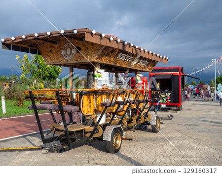Mobile beer bar. Trailer with alcohol. Stall at the festival. Interesting food trailer design Mobile beer bar. Trailer with alcohol. Stall at the festival. Interesting food trailer design 129180317