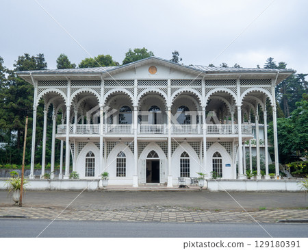 White mansion. Openwork architecture. Big old white house White mansion. Openwork architecture. Big old white house 129180391