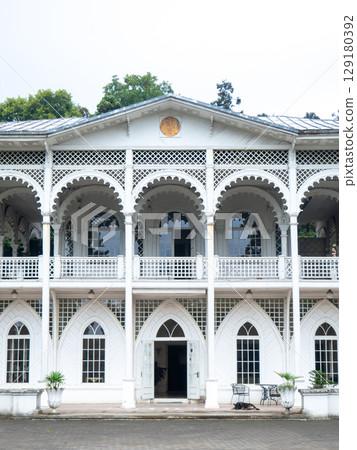 White mansion. Openwork architecture.  Big old white house 129180392