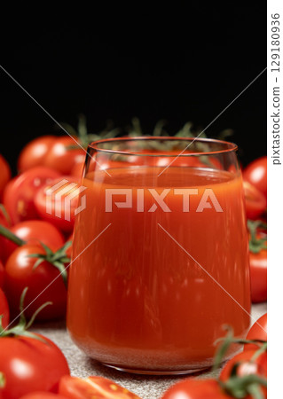 Tomato Juice and Garden Tomatoes. Natural Ingredients. Tomato Juice and Garden Tomatoes. Natural Ingredients. 129180936