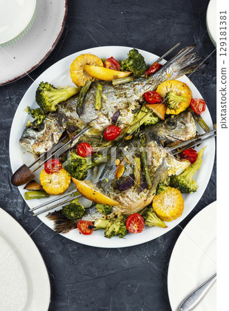 Delicious roasted fish sea bream, BBQ. Delicious roasted fish sea bream, BBQ. 129181381