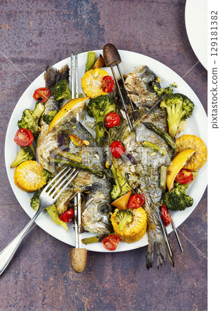 Delicious roasted fish sea bream, BBQ. Delicious roasted fish sea bream, BBQ. 129181382