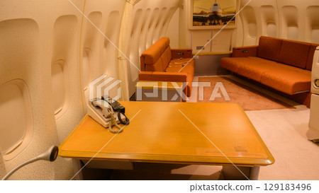 Desk and satellite phone in the VIP room of the government aircraft 129183496