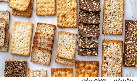 Varieties of flatbread and whole grain toast arranged as background Varieties of flatbread and whole grain toast arranged as background 129183652