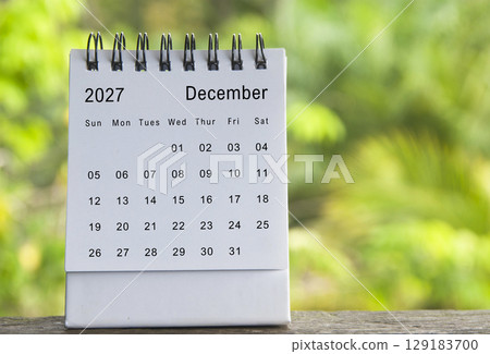 December calendar with blurred nature background. Copy space and new month concept 129183700