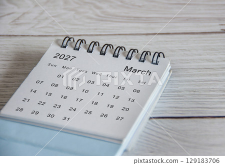 Close up of March 2027 calendar on wooden background 129183706
