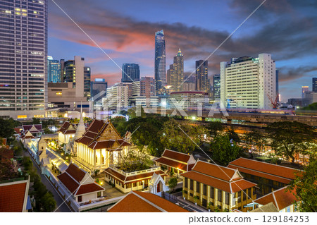 Wat Pathumwanaram Temple in the morning, view from Siam Paragon car park in Bangkok, Thailand. Wat Pathumwanaram Temple in the morning, view from Siam Paragon car park in Bangkok, Thailand. 129184253