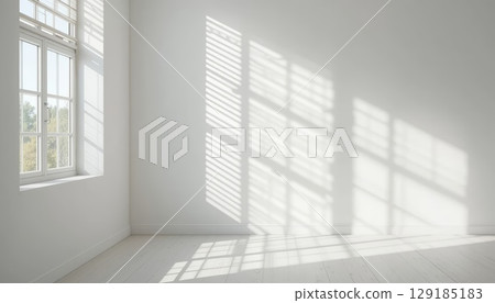 Bright Empty Room with Sunlight Streaming Through Large Windows. Bright Empty Room with Sunlight Streaming Through Large Windows. 129185183
