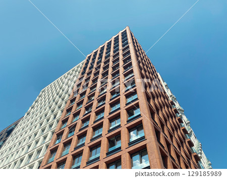 Architecture and real estate, modern residential apartment building with large panoramic windows Architecture and real estate, modern residential apartment building with large panoramic windows 129185989