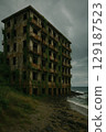 Abandoned hotel covered in ivy on the seaside 129187523