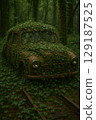 Abandoned cars in an ivy-covered forest and the regenerative power of nature 129187525