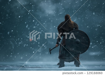 A battle-hardened Viking roars defiance amid the frozen wasteland's endless white 129188060