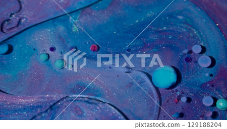 Oil fluid. Ink art. Defocused blue purple pink colorful flow glitter bubbles liquid round texture spreading on abstract acrylic background. 129188204