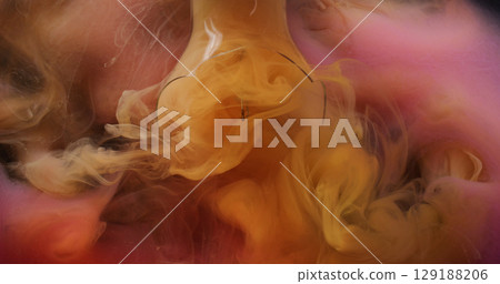 Cracked lamp. Vapor paint. Defocused orange pink color vibrant fluid splash smoke cloud filling cracked glass in water on abstract background. Cracked lamp. Vapor paint. Defocused orange pink color vibrant fluid splash smoke cloud filling cracked glass in water on abstract background. 129188206